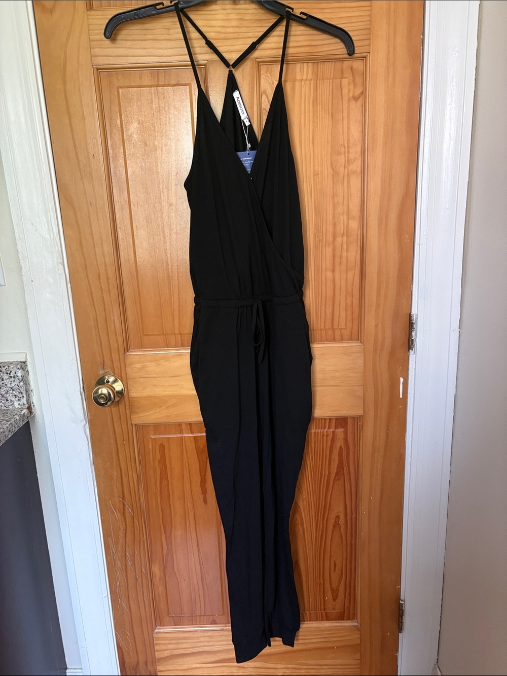 Black Strappy Jumpsuit - Sleek V-Neck Romper
